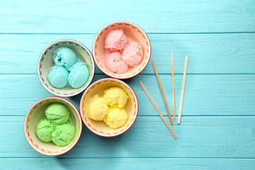Ice cream collection in bowls on wooden background