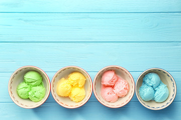 Ice cream collection in bowls on wooden background