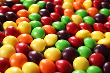 Fototapeta na wymiar Delicious colorful candies as background