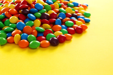 Colorful candies on color background