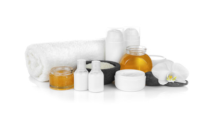 Spa setting with nutrient cosmetic and delicious honey on white background