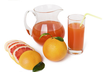 Grapefruit juice in a jug and grapefruit