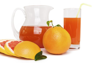 Grapefruit juice in a jug and grapefruit