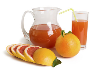 Grapefruit juice in a jug and grapefruit