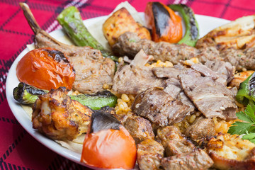mixed kebab served on plate