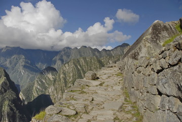 Stone trail in ancient Inca citadel Machu Picchu, Peru.