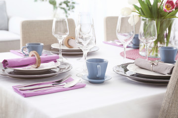Table with beautiful setting in restaurant, closeup