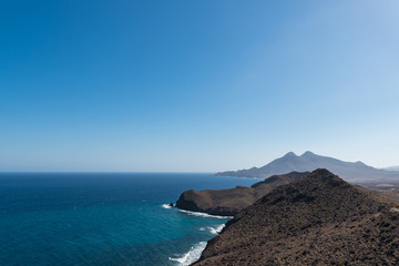 mountains by the sea coastline