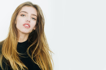 Naklejka premium Pretty girl with long blond hair in black clothes