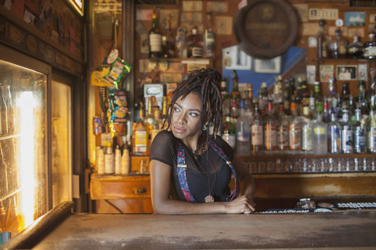 A young woman at a bar.