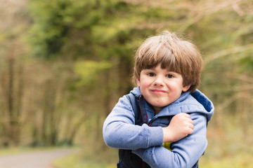 Outdoor portrait of cute young boy