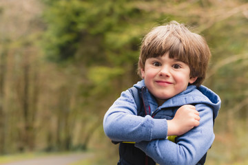 Outdoor portrait of cute young boy