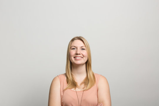 Studio portrait of an excited young woman