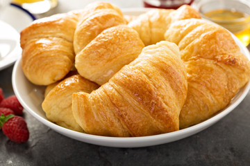 Freshly baked croissants in a bowl