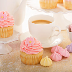 Vanilla cupcakes with pink raspberry frosting