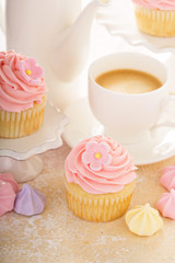 Vanilla cupcakes with pink raspberry frosting