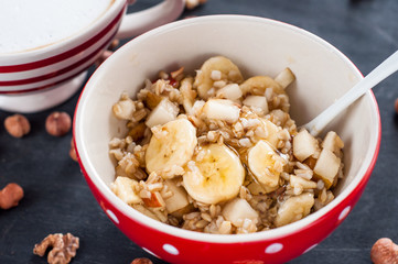 Healthy breakfast, oatmeal, banana, pear, honey, flax seeds, chia seeds
