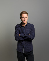 Studio portrait of a pensive young man