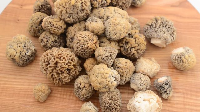 Mushrooms morels on a wooden board.