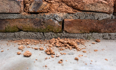 broken brick wall with blurred small gravel, fail of life concept