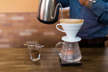 Barista making a drip coffee