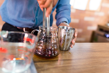 Barista making a drip coffee in cafe