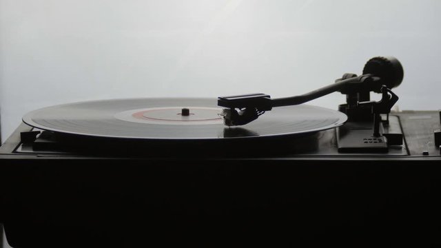 Old vintage gramophone playing lp vinyl record