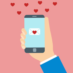 Hearts and love message on mobile phone screen