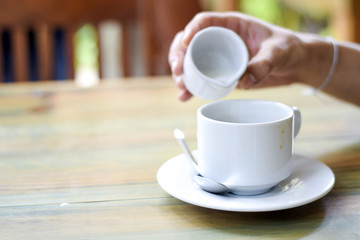 Male hand pouring cream