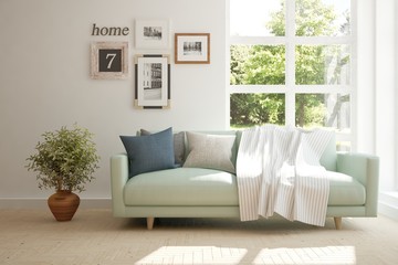 White room with sofa and green landscape in window. Scandinavian interior design. 3D illustration