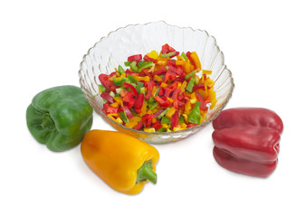 Chopped and whole green, yellow and red bell peppers