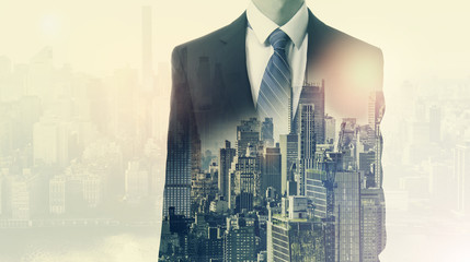 Double exposure of business man and city