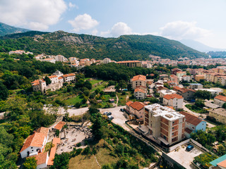 Fototapeta na wymiar Construction of a multistory building in Budva, Podmayne district, near the monastery, Montenegro. aerial survey