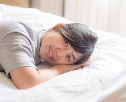 Chinese Woman Lying on Bed