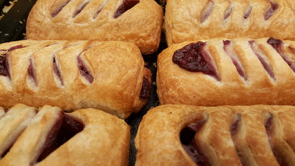 Pastry with cherry on tray