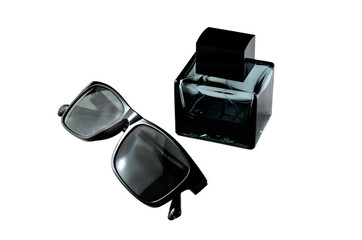 Sunglasses and bottle on white background
