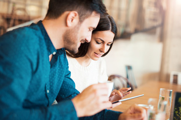 Young couple drinking coffee in a cafe. Dating, relationships, love, romance, lifestyle