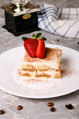Tiramisu - Classical Dessert with Coffee. Garnished with Strawberry