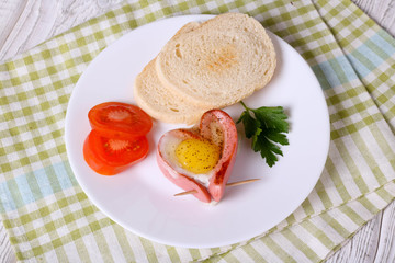 sausage in a heart-shaped fried egg