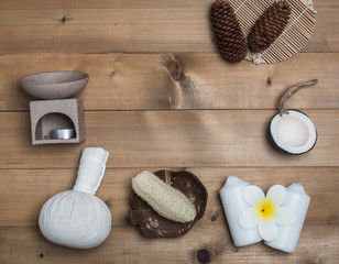 Fototapeta na wymiar Aromatherapy product Spa set ,candle ,soap,coconut,flower,shell, massage with wood background .
