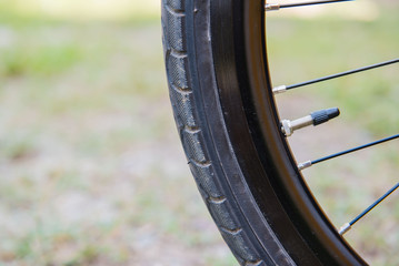 Closeup black Bicycle tire. bike wheel fragment.