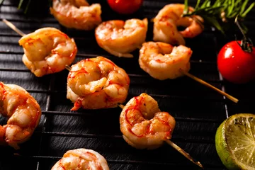Gordijnen Grilled shrimp skewers. © gkrphoto