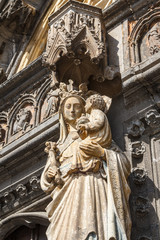 Fototapeta na wymiar Gothic details of the church portal in Dinant, Belgium