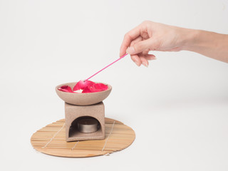 Aromatherapy  product  Spa massage set  hold by hand   with white background .