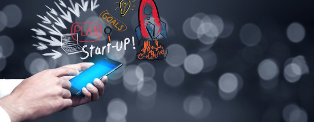 Businessman connecting devices and technology application icons