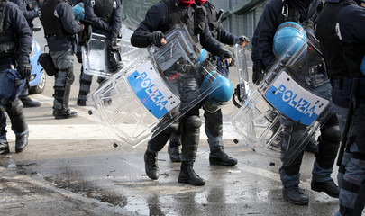 police with shields and riot gear during the event in the city