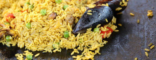 Spanish paella with mussels and tasty yellow rice and seafood © ChiccoDodiFC