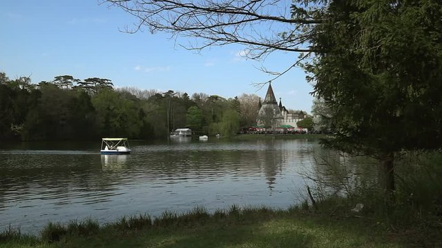 view across the pond in the palace park of Laxenburg to the castle Franzensburg, Austria