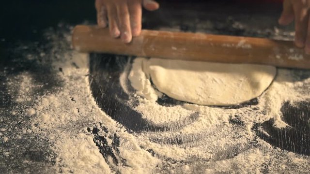 Chef preparing pizza dough. Slow Motion