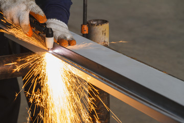 Manual Plasma Cutting Machine on Steel for Structure Fabrication Work. - obrazy, fototapety, plakaty
